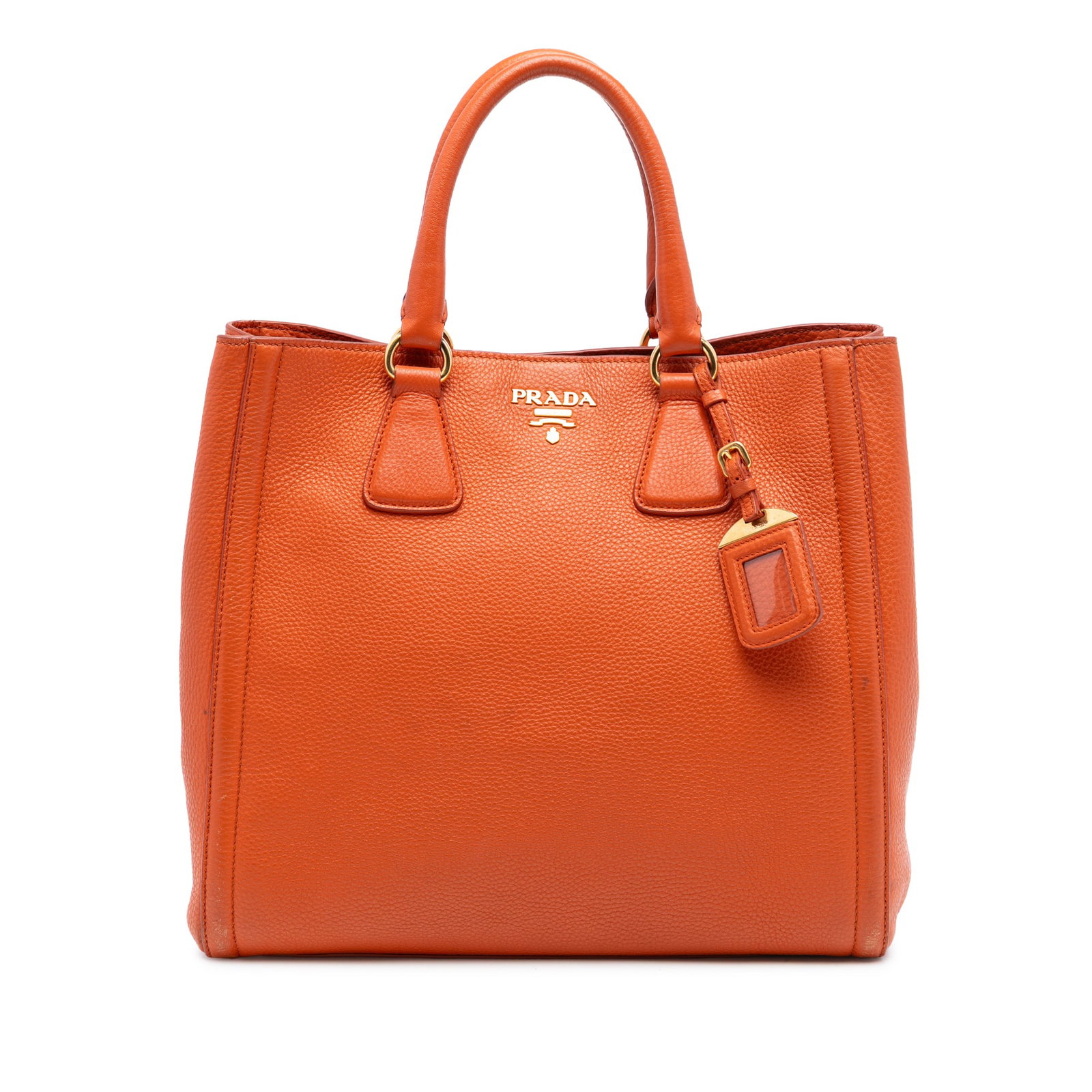 Prada Orange Leather Convertible Tote Bag Vitello Daino: Prada Orange Leather Convertible Tote Bag Vitello Daino This Prada Vitello Daino Open Convertible Tote is crafted from saffiano leather in a vibrant orange hue. It features rolled leather handles, an 