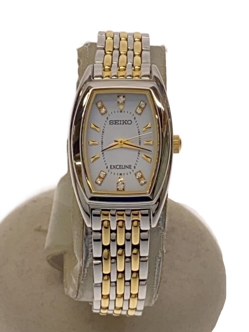Seiko Exceline Solar Ladies Gold Tone White Dial Watch: Seiko Exceline Solar Ladies Gold Tone White Dial Watch This SEIKO Exceline SWCQ089 is a solar-powered women's wristwatch featuring a white dial and gold tone accents. Made in Japan, it offers a refine