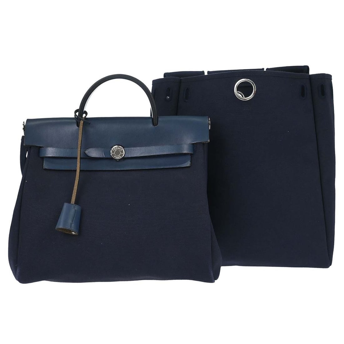 Hermes Herbag a Dos 2 in 1 Navy Toile Officier Backpack: Hermes Herbag a Dos 2 in 1 Navy Toile Officier Backpack Vintage Hermes Herbag a Dos 2 in 1 backpack in navy Toile Officier with leather trim. This women's medium backpack features a convertible design