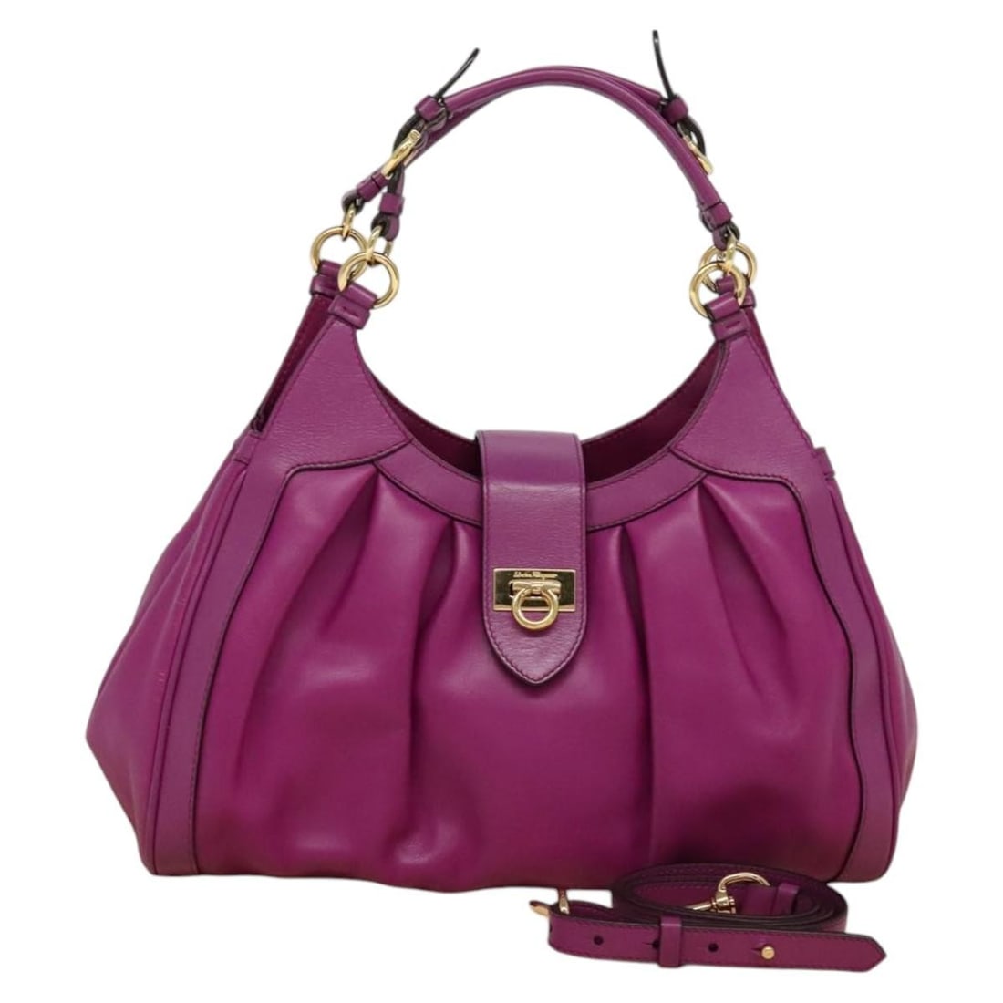 Salvatore Ferragamo Purple Gold Leather Gancini 2way Handbag: Salvatore Ferragamo Purple Gold Leather Gancini 2way Handbag This Salvatore Ferragamo Gancini handbag is crafted from high-quality leather in a striking purple and gold color combination. Designed for