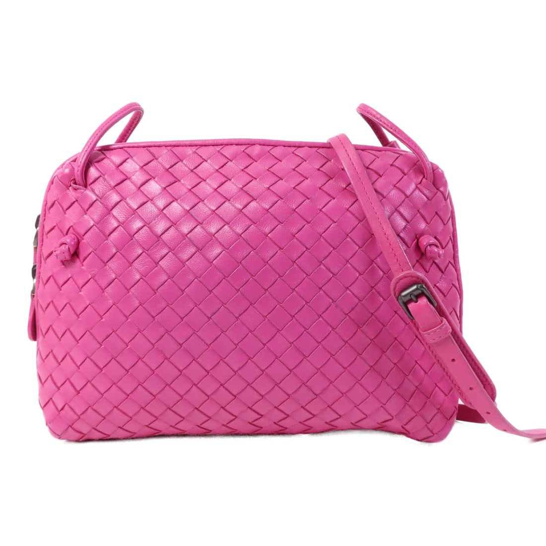 Pink Lambskin Nodini Shoulder Bag by Bottega Veneta: Pink Lambskin Nodini Shoulder Bag by Bottega Veneta This Bottega Veneta Nodini shoulder bag features soft lambskin leather in a stylish pink color. Designed for women, the bag offers a compact silhoue