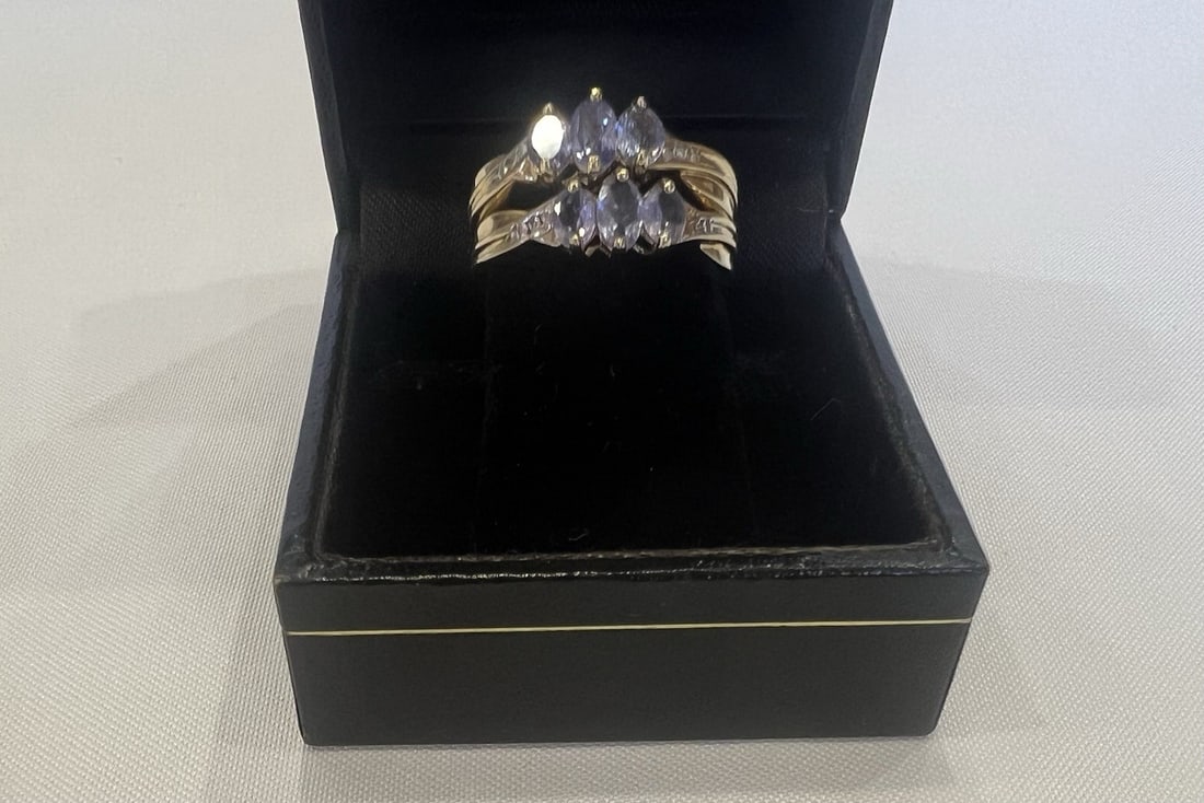 Pair of 14k Gold Tanzanite Rings Size 4.75: Pair of 14k Gold Tanzanite Rings Size 4.75 This listing features a set of two pre-owned rings crafted from 14k gold, each adorned with tanzanite gemstones. Both rings are size 4.75 and together weigh 