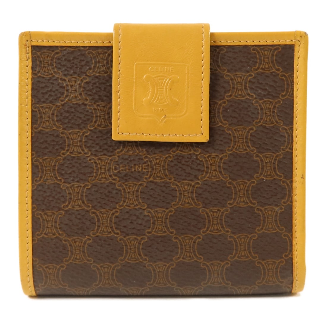 CELINE Brown Calfskin Bi-fold Wallet GHW Vintage: CELINE Brown Calfskin Bi-fold Wallet GHW Vintage This vintage CELINE bi-fold wallet is crafted from brown calfskin leather, offering a classic and elegant accessory for women. Made in France, it featu