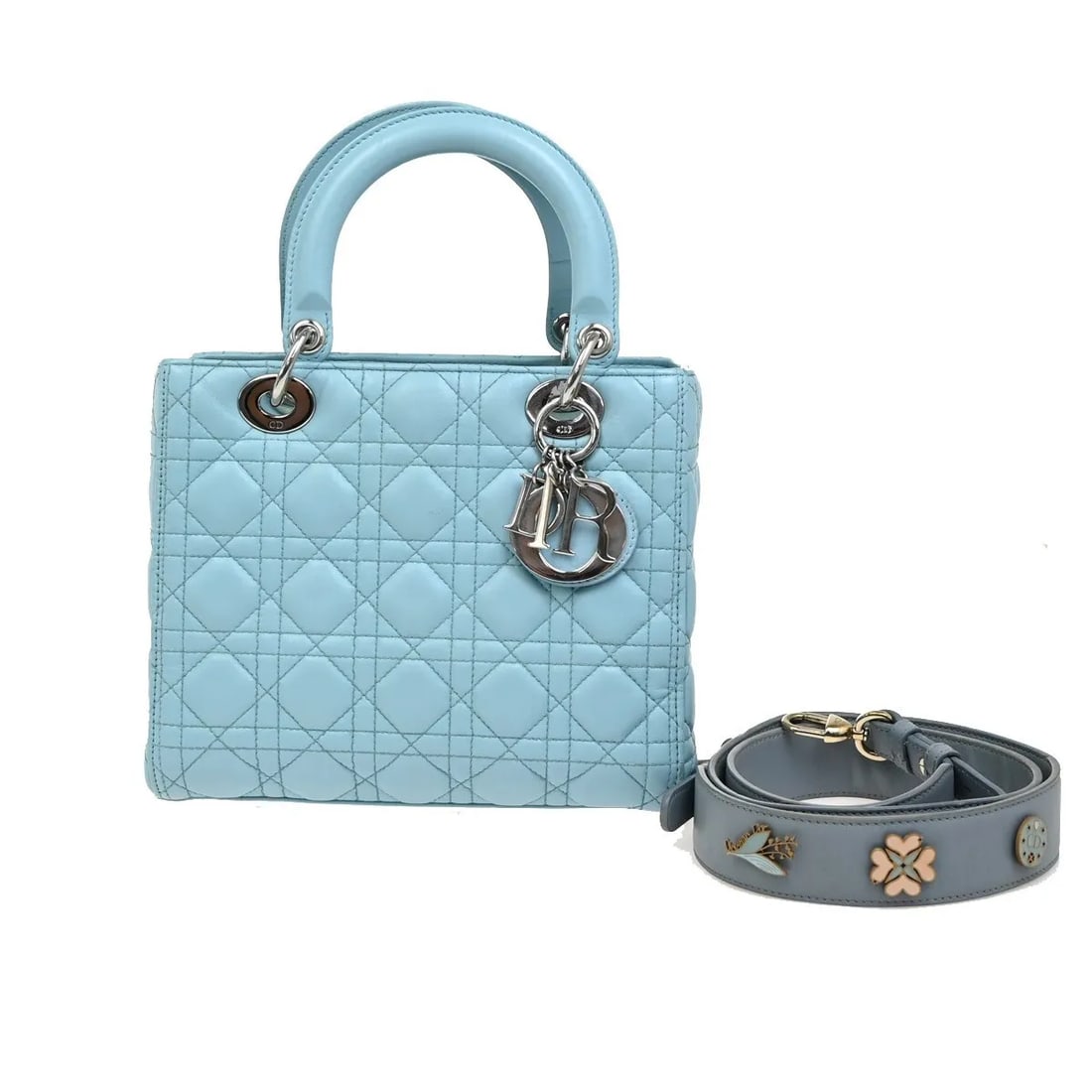 Christian Dior Lady Dior blue leather handbag: Christian Dior Lady Dior blue leather handbag This Christian Dior Lady Dior bag is crafted from blue leather and showcases the iconic design associated with the brand. Made in Italy, it features a str