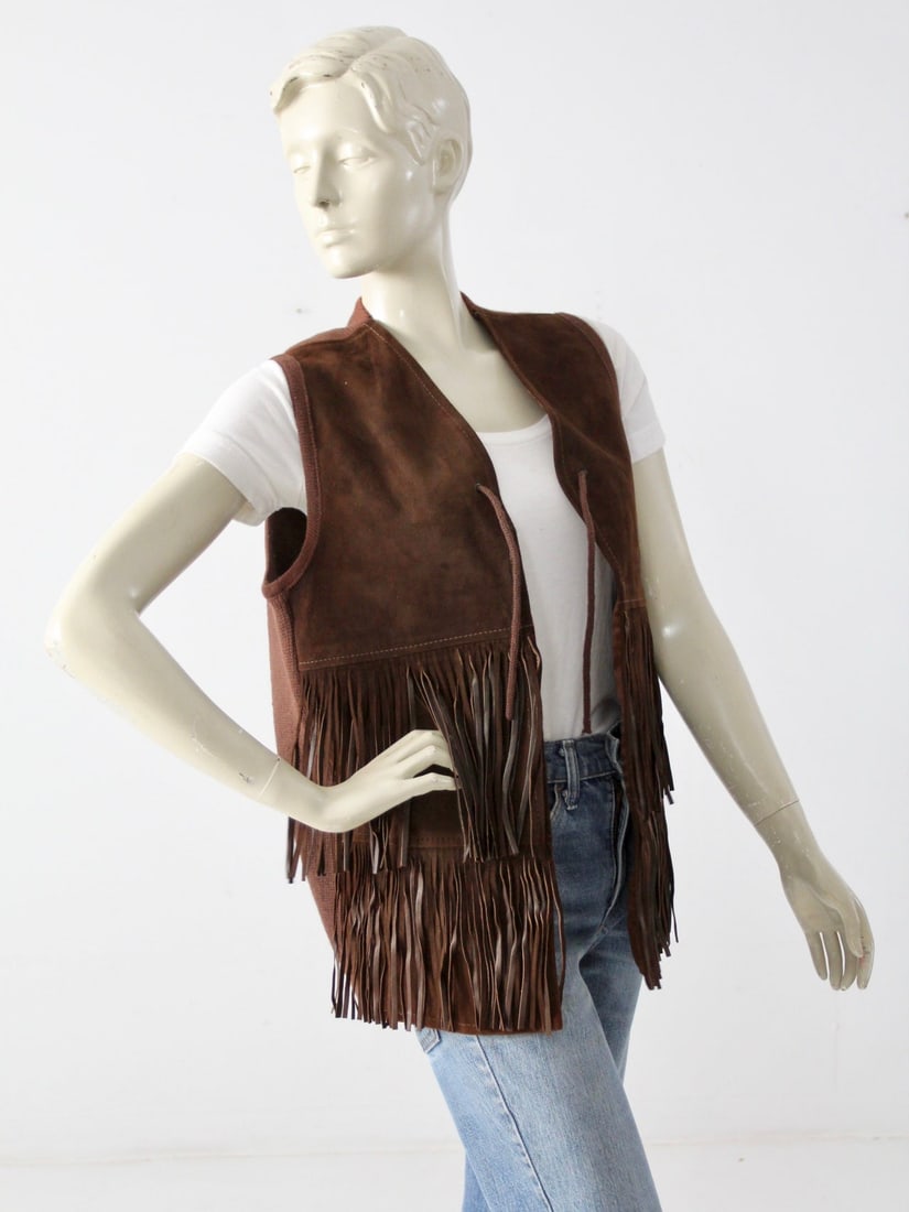 1970s Vintage Dark Brown Suede Fringe Knit Vest: 1970s Vintage Dark Brown Suede Fringe Knit Vest Step back into the 1970s with this vintage fringe suede and knit vest. This unique piece showcases a dark brown suede front adorned with two tiers of fl