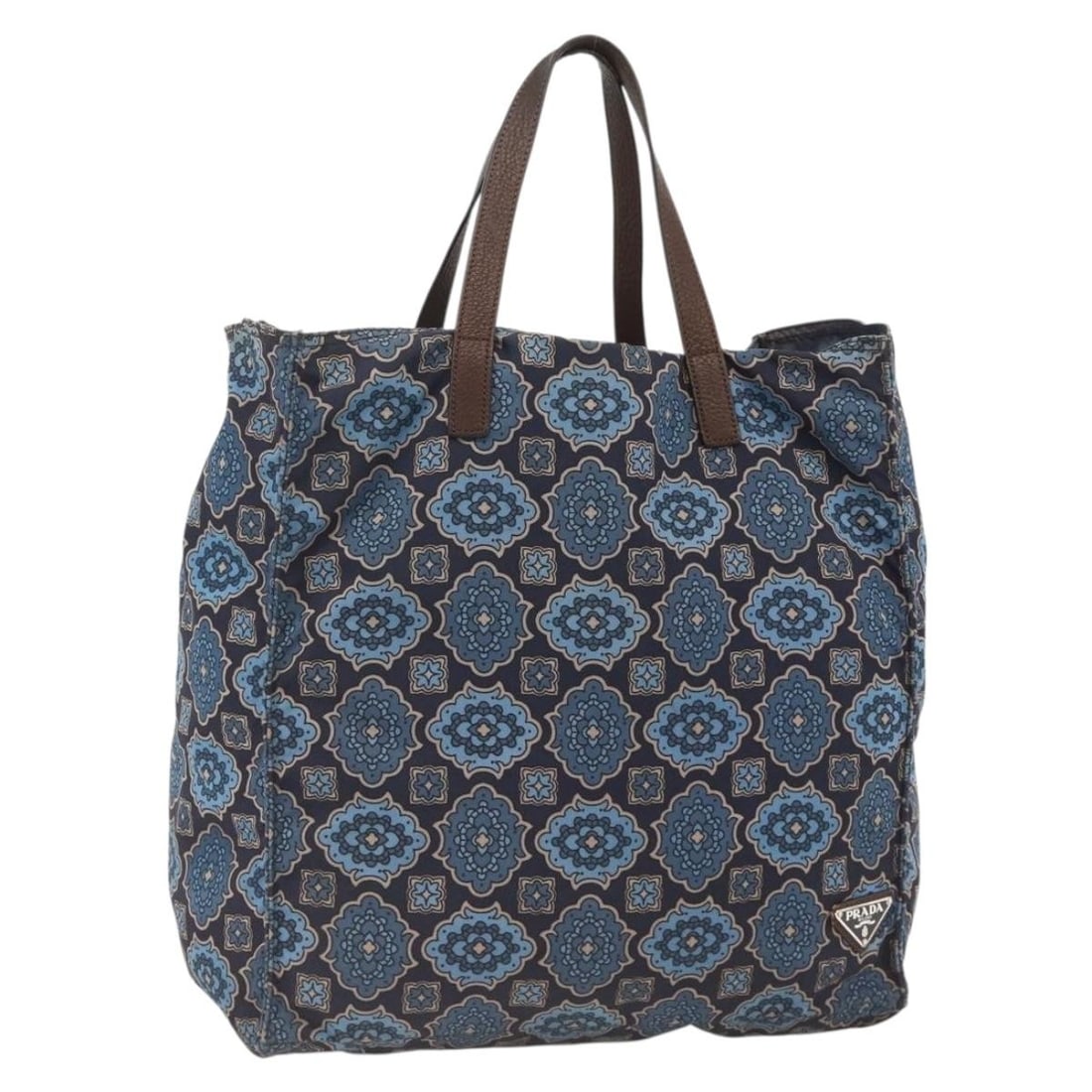 Blue Nylon PRADA Tote with Silver Accents for Women: Blue Nylon PRADA Tote with Silver Accents for Women This PRADA tote bag is crafted from blue and silver nylon, featuring dual handles and a spacious interior. Designed for women, it offers practical s
