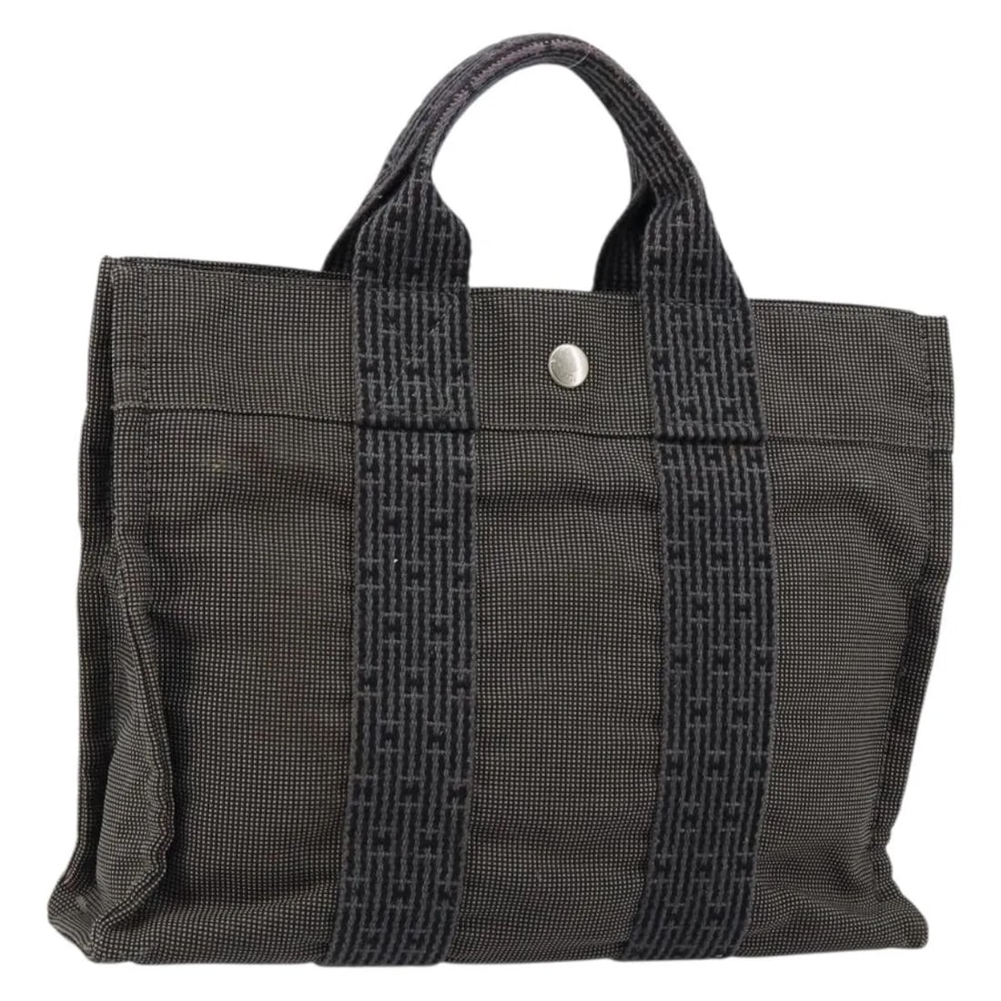 Gray Canvas Tote Bag Hermes Fourre-tout Herline Model 30cm: Gray Canvas Tote Bag Hermes Fourre-tout Herline Model 30cm The Hermes Fourre-tout Herline tote bag is crafted from gray canvas and designed for women. This pre-owned bag is in good condition, showing 