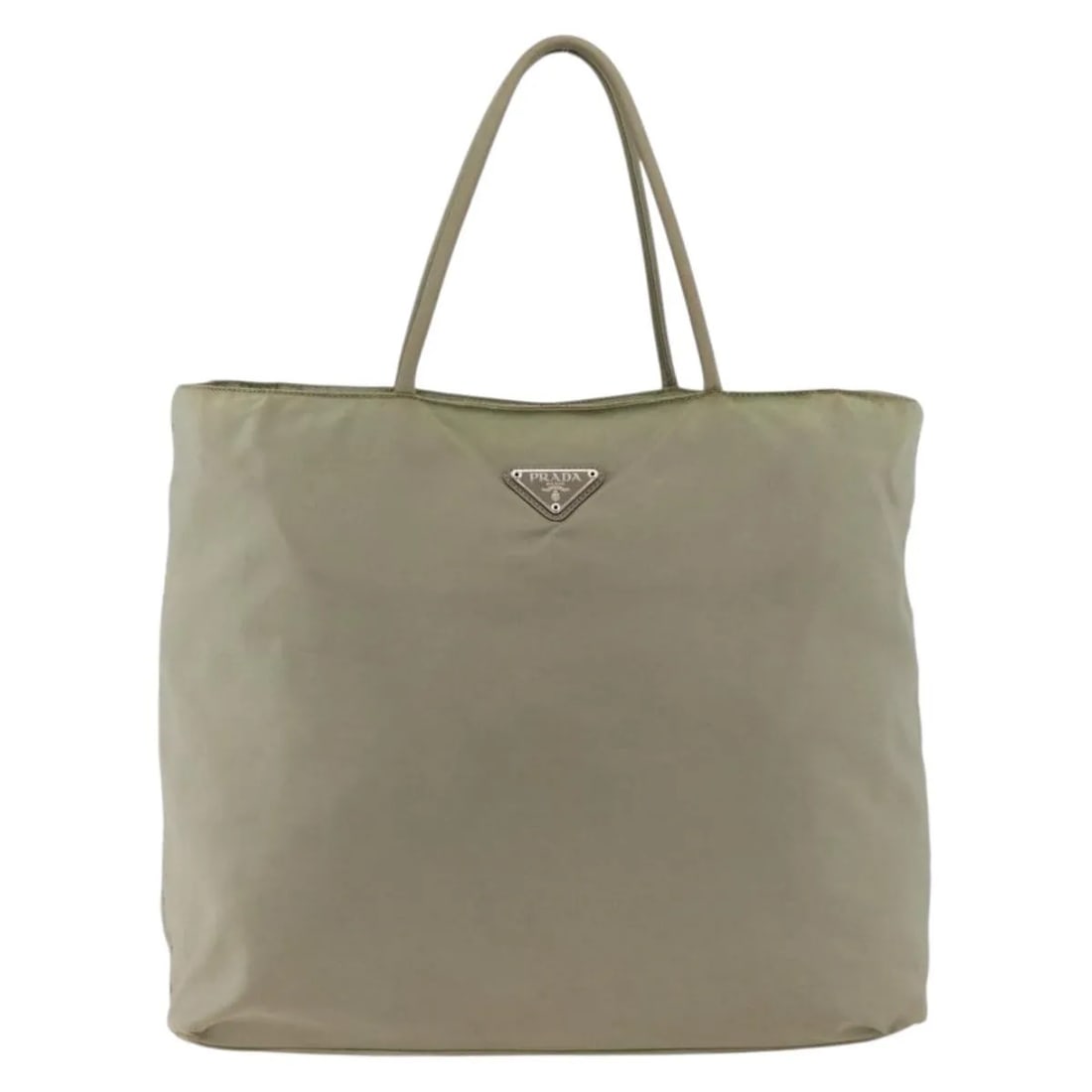 Beige Nylon Tote Bag Prada Vintage Collection Italy: Beige Nylon Tote Bag Prada Vintage Collection Italy This Prada Vintage Tote is crafted from beige nylon and designed for women. The bag features signs of wear, including rubbing and stains on the exte