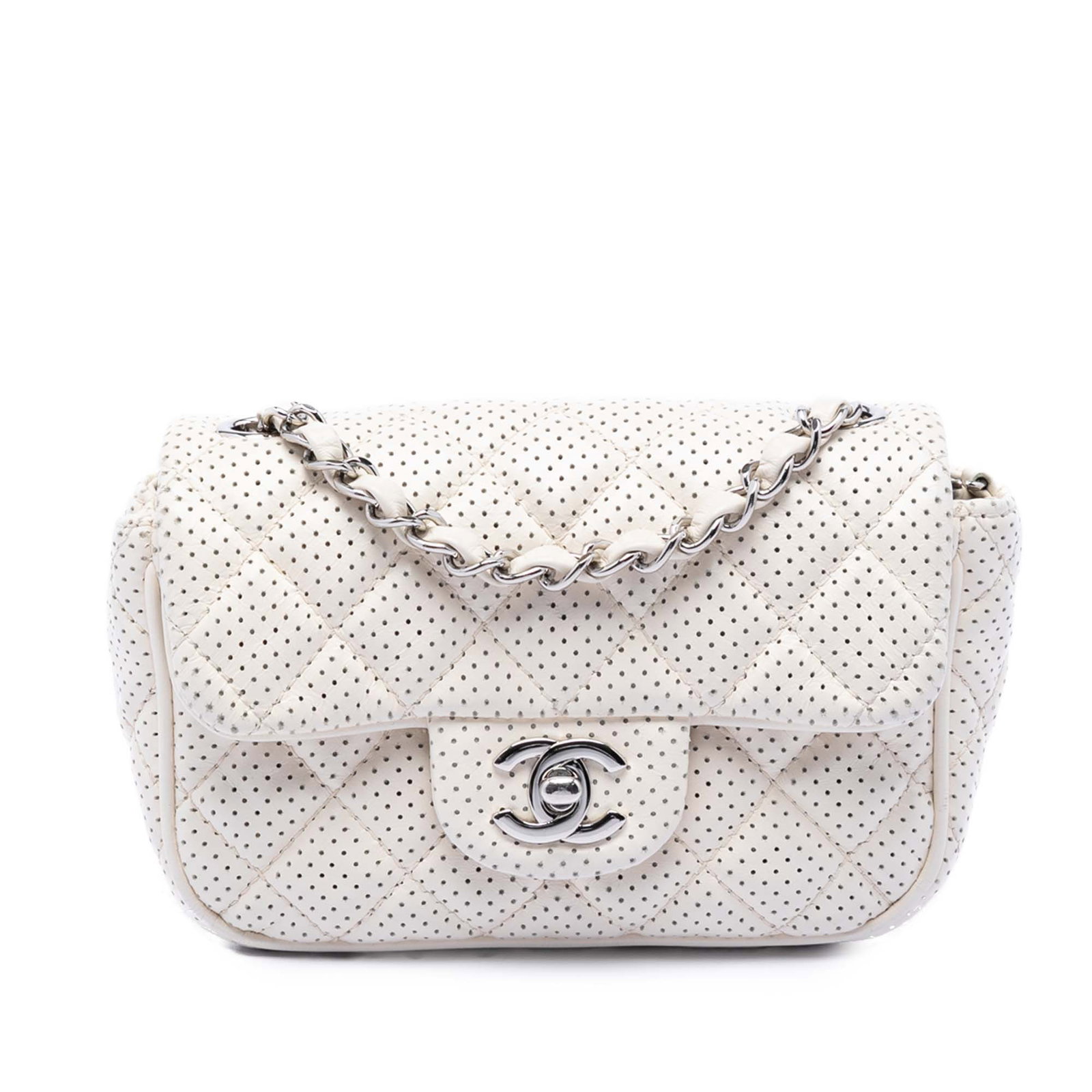 Chanel Punch Flap Mini Crossbody in White Perforated Lambskin: Chanel Punch Flap Mini Crossbody in White Perforated Lambskin Chanel Mini Perforated Lambskin Punch Flap crossbody bag in white. This bag features a quilted perforated lambskin leather body, a leather