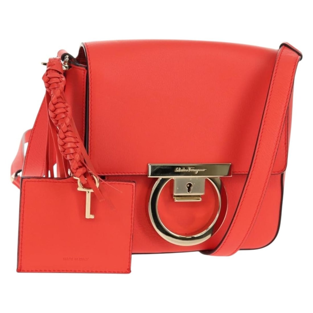 Salvatore Ferragamo Gancini Red Leather Shoulder Bag with Gold Accents: Salvatore Ferragamo Gancini Red Leather Shoulder Bag with Gold Accents This exquisite Salvatore Ferragamo Gancini Shoulder Bag showcases a stunning red leather exterior complemented by elegant gold ac