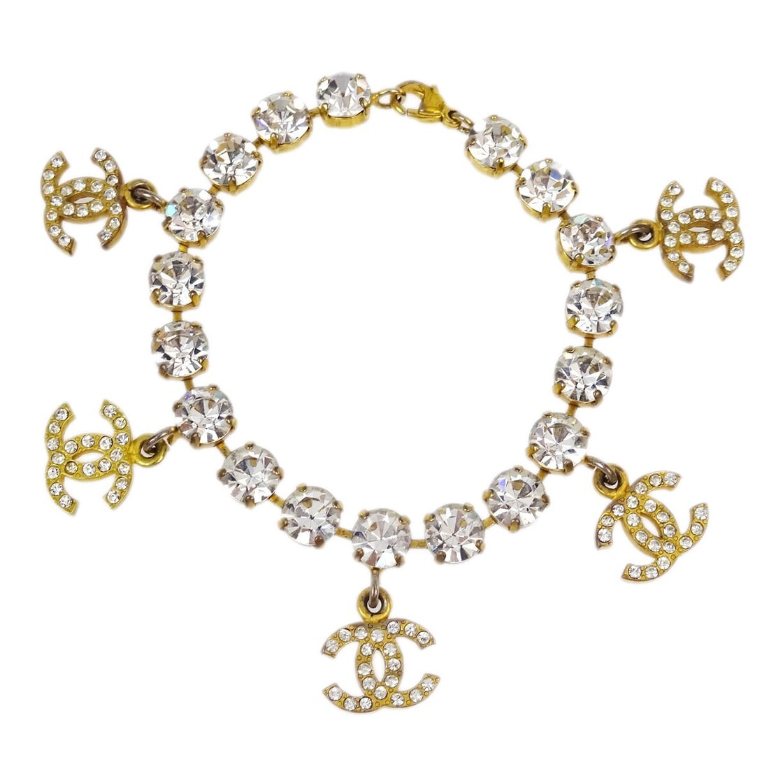 CHANEL 95A Gold Plated Chain Bracelet with Rhinestones: CHANEL 95A Gold Plated Chain Bracelet with Rhinestones Chanel chain bracelet in gold-plated metal with rhinestone detailing and Chanel logo charms. Made in France, this bracelet is marked 95A and come