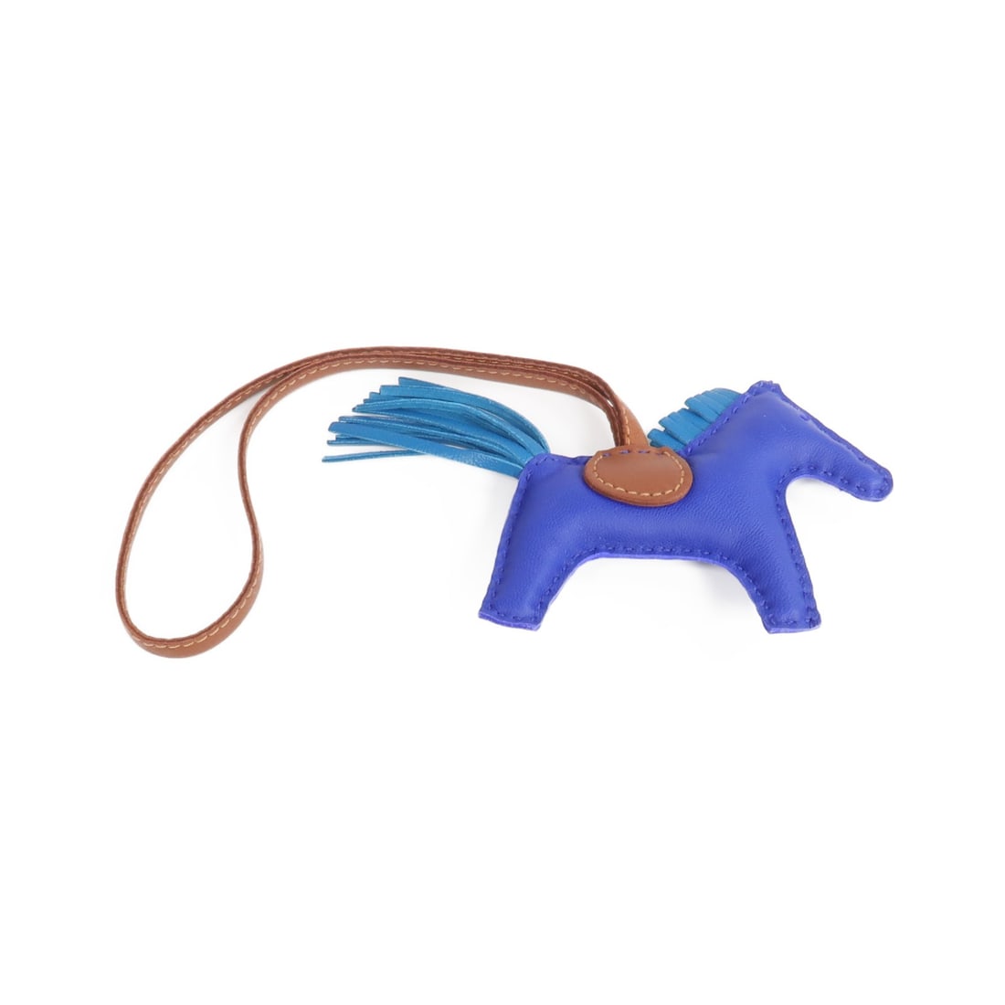 Hermes Rodeo PM Blue Lambskin Bag Charm: Hermes Rodeo PM Blue Lambskin Bag Charm This Hermes Rodeo PM Charm is crafted from soft Milo lambskin leather in a striking blue shade. Designed for women, this accessory adds a touch of playful elega