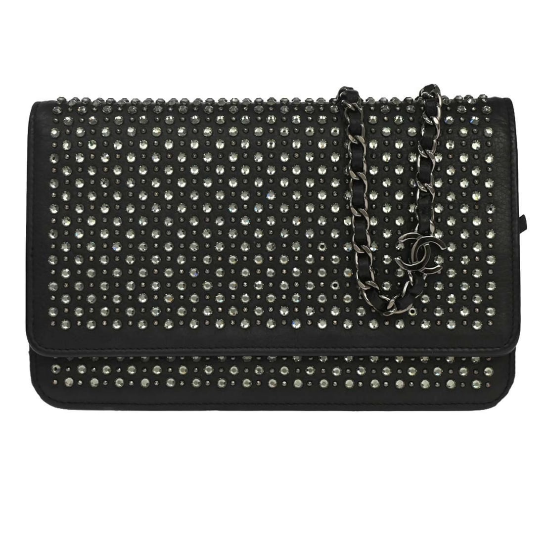 CHANEL WOC chain wallet in black calfskin with rhinestones: CHANEL WOC chain wallet in black calfskin with rhinestones Chanel wallet on chain bag in black calfskin with rhinestone detailing. This folding design features a structured interior with two zip pocke