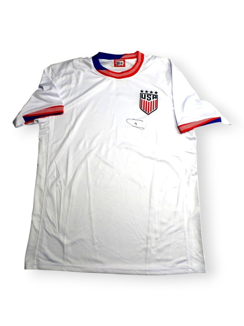 Christian Pulisic Autographed Team USA Jersey Beckett Authenticated: Christian Pulisic Autographed Team USA Jersey Beckett Authenticated This original Team USA jersey is autographed by soccer star Christian Pulisic, showcasing his signature in a prominent location. The