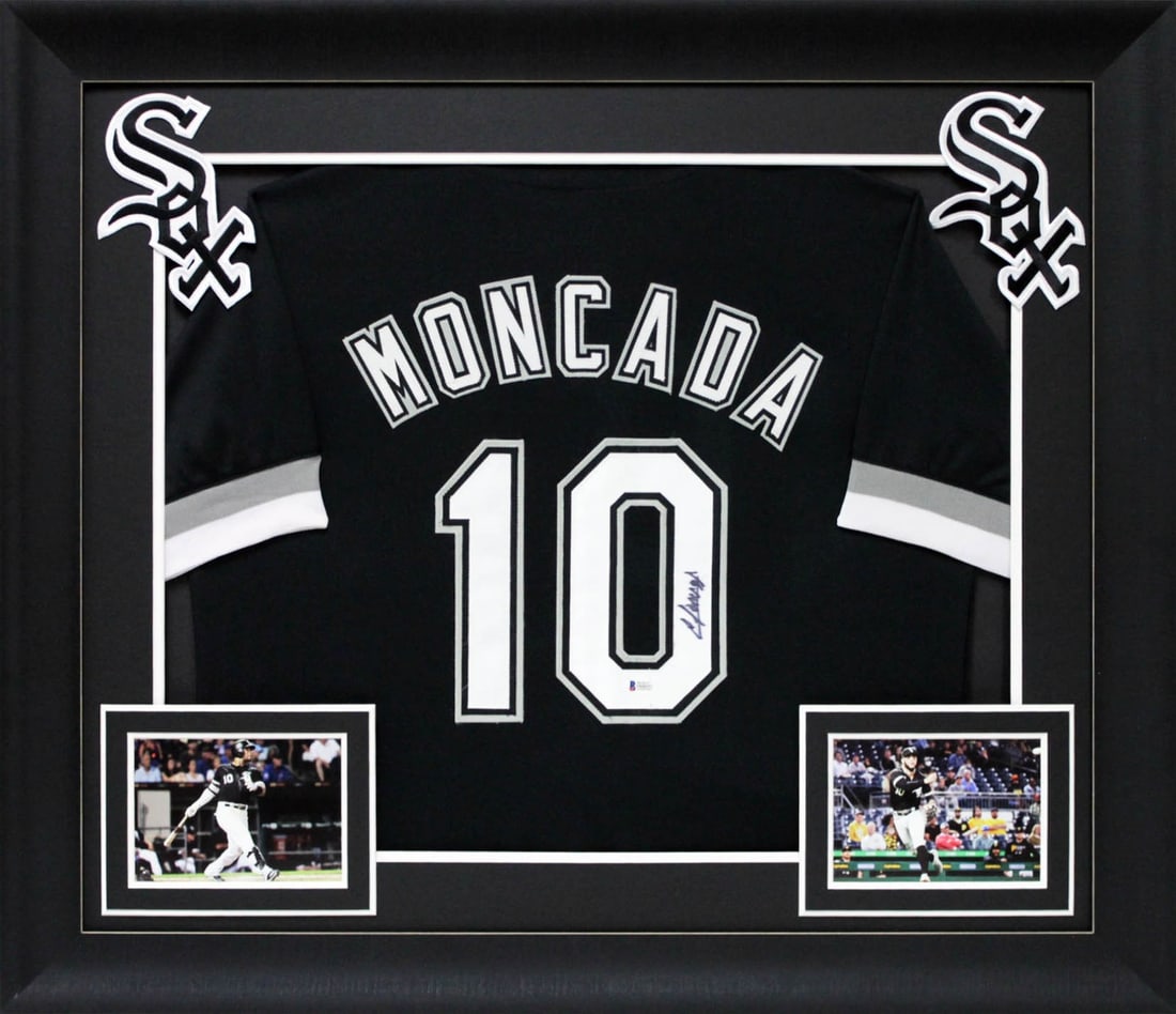 Framed Black Pro Style Jersey Signed by Yoan Moncada Beckett Authenticated: Framed Black Pro Style Jersey Signed by Yoan Moncada Beckett Authenticated Autographed black pro style framed jersey personally signed by Yoan Moncada of the Chicago White Sox. It is an original, hand