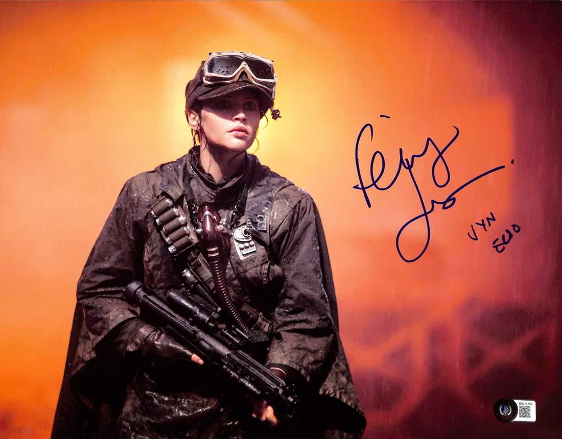 Autographed 11x14 Photo Felicity Jones as Jyn Erso Beckett Authenticated: Autographed 11x14 Photo Felicity Jones as Jyn Erso Beckett Authenticated This is an autographed 11x14 inch color photograph featuring Felicity Jones as Jyn Erso from Star Wars Rogue One. Signed in blu