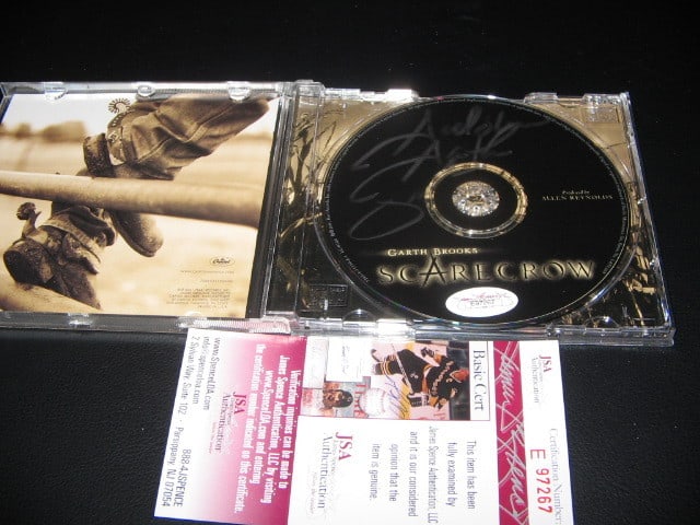 Signed Garth Brooks Scarecrow CD with JSA COA: Signed Garth Brooks Scarecrow CD with JSA COA This is a pre-owned, original Garth Brooks 'Scarecrow' CD that has been signed by the artist. The item is accompanied by a certificate of authenticity. Sp