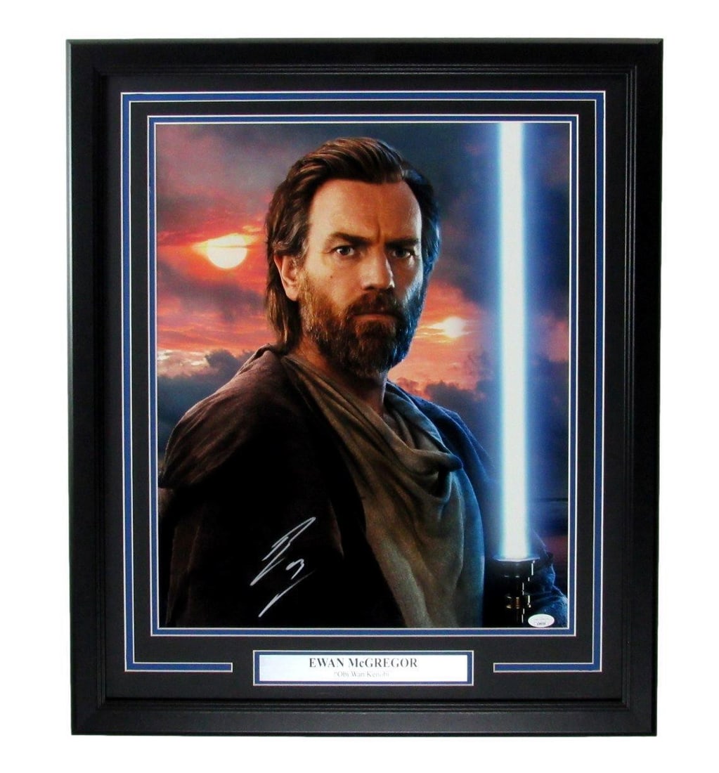 Ewan McGregor Signed 16x20 Obi-Wan Kenobi Photo Framed JSA Authenticated: Ewan McGregor Signed 16x20 Obi-Wan Kenobi Photo Framed JSA Authenticated This stunning 16x20 photo features Ewan McGregor as Obi-Wan Kenobi, beautifully framed and autographed. The piece is an