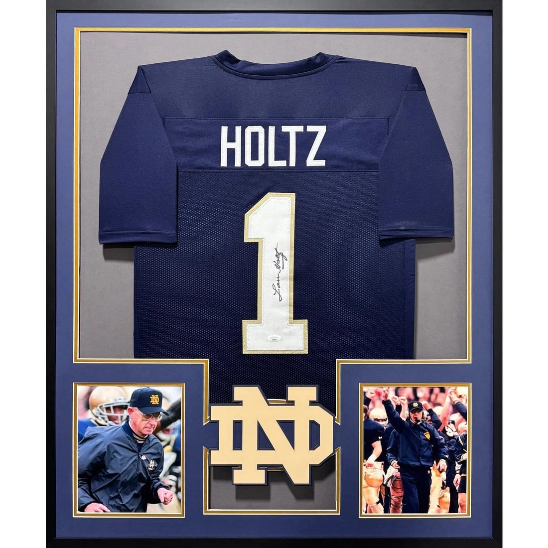 Framed Lou Holtz Signed Notre Dame Jersey JSA Authenticated: Framed Lou Holtz Signed Notre Dame Jersey JSA Authenticated This is a framed Notre Dame jersey autographed by Lou Holtz. The jersey comes with JSA authentication and features a tamper-proof sticker fo
