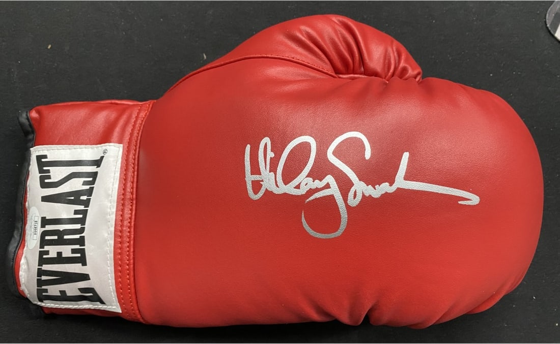 Red Left Boxing Glove Signed by Hilary Swank JSA Million Dollar Baby: Red Left Boxing Glove Signed by Hilary Swank JSA Million Dollar Baby This is a red left-handed boxing glove autographed by Hilary Swank, star of the film Million Dollar Baby. The glove has been authen
