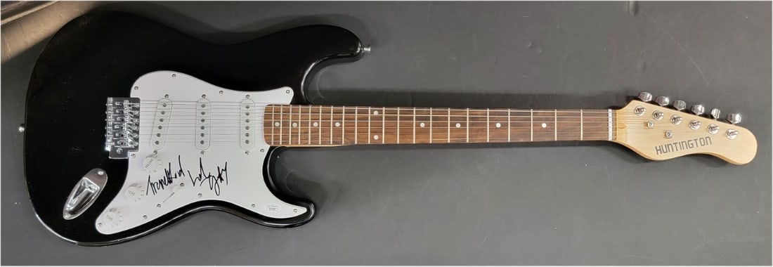 Beckett Authenticated Devo Guitar Signed by Bob and Gerald Casale: Beckett Authenticated Devo Guitar Signed by Bob and Gerald Casale This guitar and guitar pick set is hand-signed by Bob Casale and Gerald Casale of Devo. The autographs have been authenticated by Beck