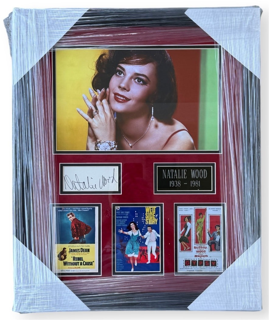 Framed Natalie Wood autograph cut West Side Story PSA DNA 18x22: Framed Natalie Wood autograph cut West Side Story PSA DNA 18x22 This is an original autographed cut signed by Natalie Wood, presented in a framed display inspired by West Side Story. The frame measure