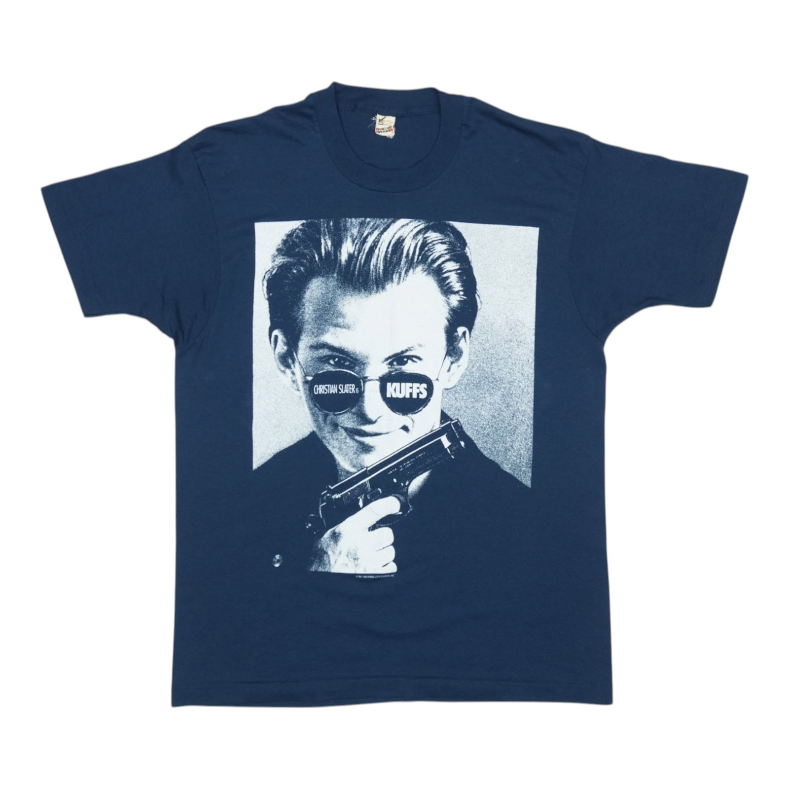 Vintage 1991 Kuffs Film Promo Blue Shirt Featuring Christian Slater: Vintage 1991 Kuffs Film Promo Blue Shirt Featuring Christian Slater This is an original vintage 1991 promo shirt for the movie "Kuffs" featuring Christian Slater. The shirt is made from a 50/50 poly/c