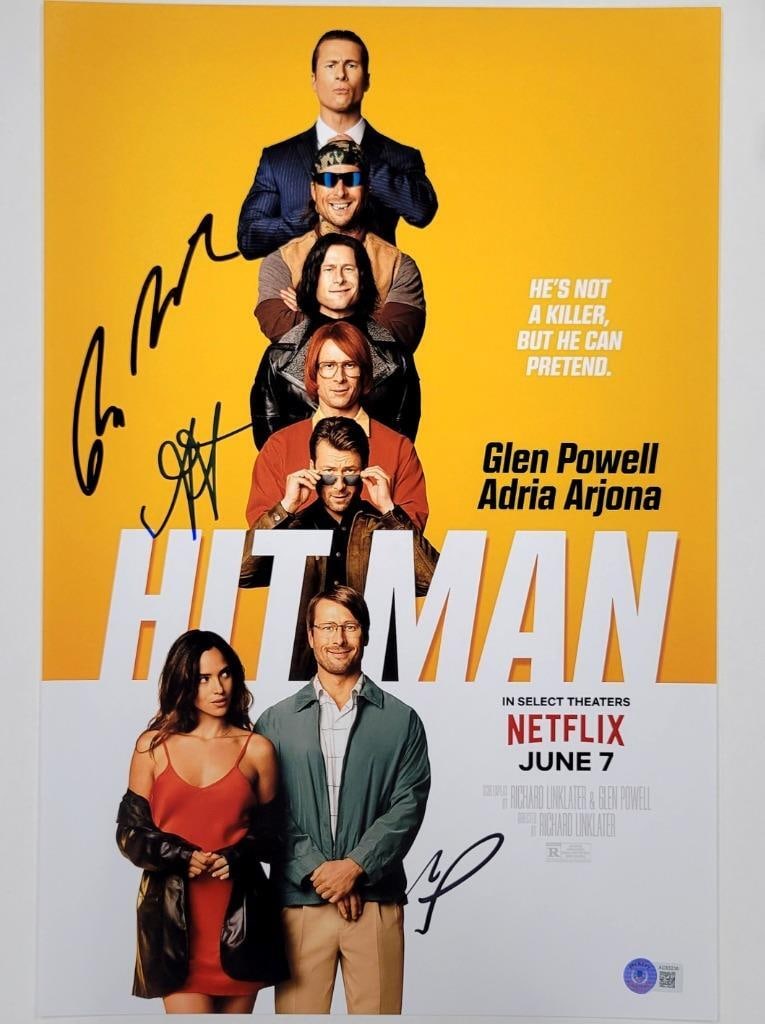 Hit Man Movie Cast Signed 12x18 Photo Beckett Authenticated: Hit Man Movie Cast Signed 12x18 Photo Beckett Authenticated This is an original 12x18 photograph from the movie Hit Man, featuring signatures from cast members Powell, Arjona, and Linklater. The autog