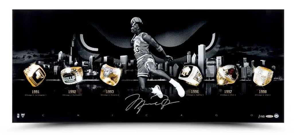 Michael Jordan Autographed City of Rings Silver Photo #/123 Upper Deck: Michael Jordan Autographed City of Rings Silver Photo #/123 Upper Deck This stunning 15X36 photo titled "City of Rings" features an iconic moment of Michael Jordan's career, capturing his legendary fr