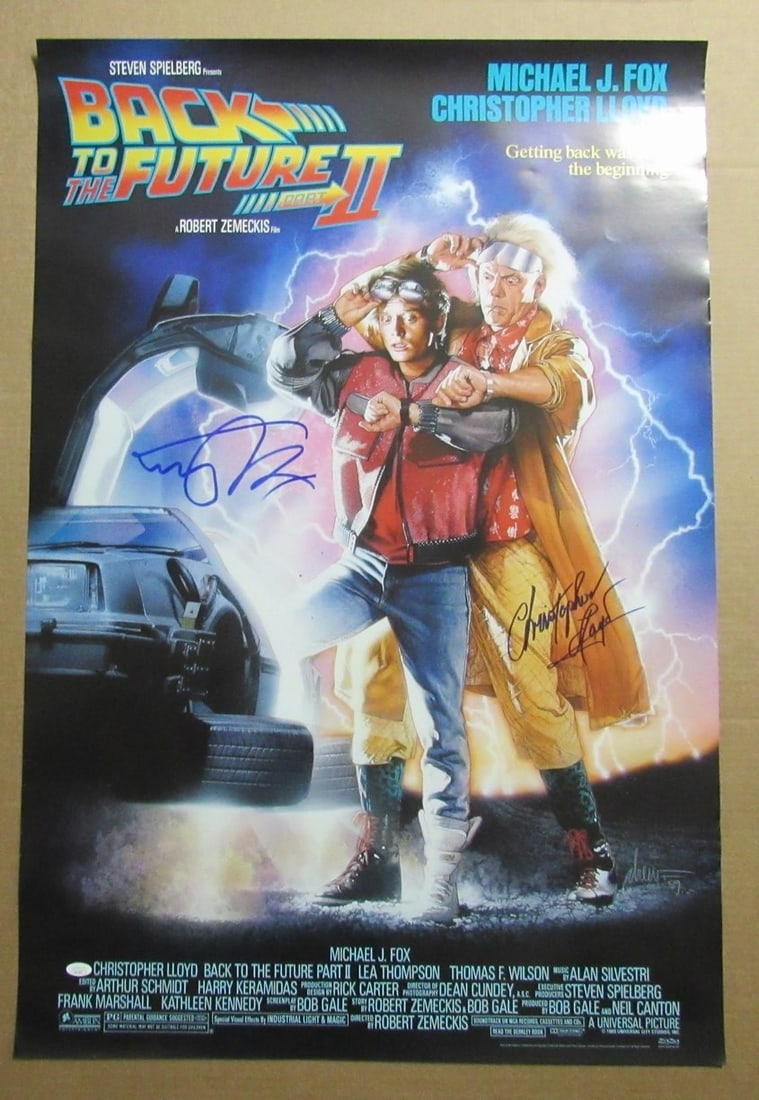 Signed Back to Future II 27x40 Poster Michael J Fox Christopher Lloyd JSA: Signed Back to Future II 27x40 Poster Michael J Fox Christopher Lloyd JSA This is a 27x40 inch poster from "Back to the Future II," autographed by Michael J. Fox and Christopher Lloyd. The signatures 