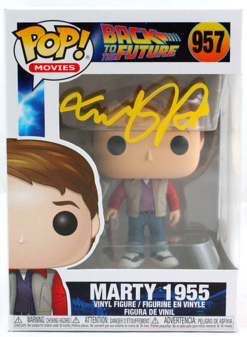 Funko Marty 1955 Figure #957 Signed by Michael J. Fox JSA: Funko Marty 1955 Figure #957 Signed by Michael J. Fox JSA Funko Pop figurine featuring Marty from 1955, autographed by Michael J. Fox. The item is pre-owned and includes JSA authentication as noted in