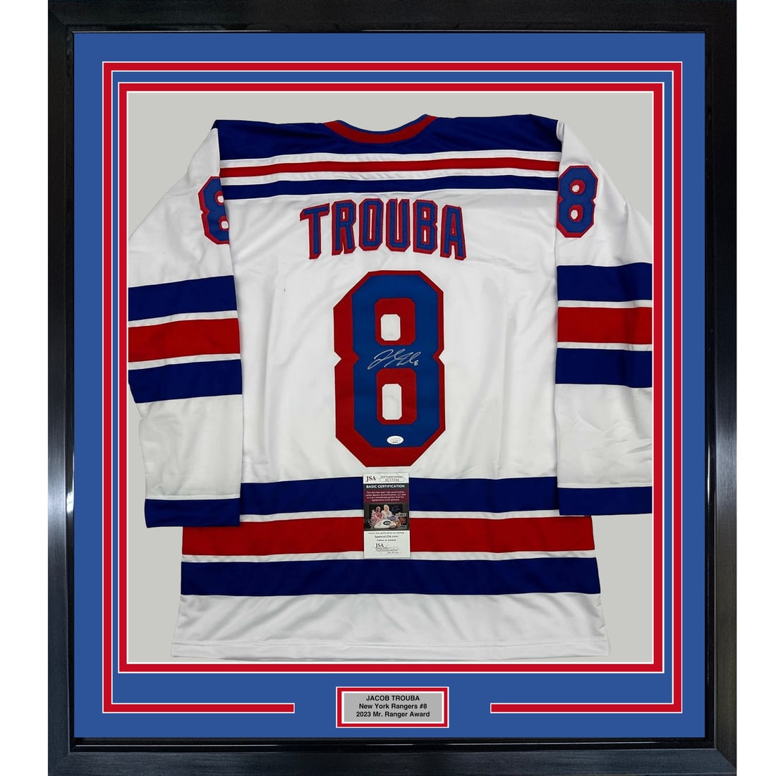 Framed Signed Jacob Trouba New York Rangers Jersey with JSA COA: Framed Signed Jacob Trouba New York Rangers Jersey with JSA COA Celebrate your passion for hockey with this professionally framed and matted autographed jersey of Jacob Trouba, a notable player for th