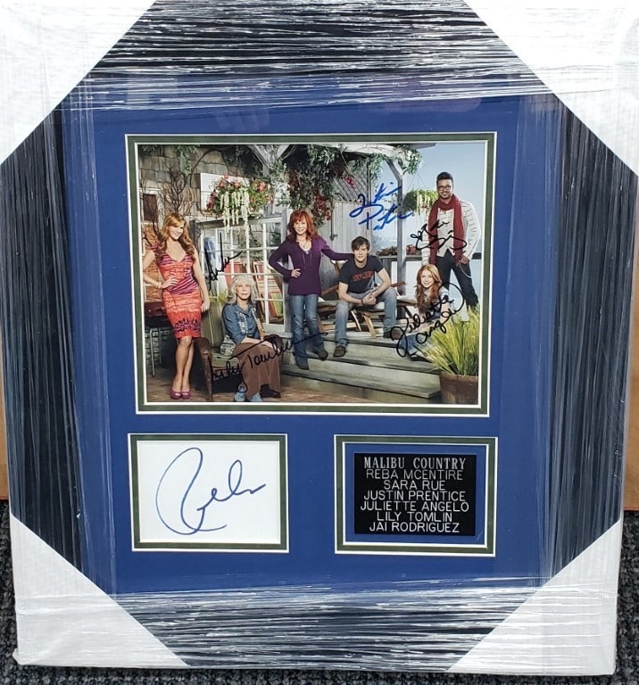 Framed Malibu Country Photo Signed by Reba McEntire Sara Rue Lily Tomlin Beckett Authenticated: Framed Malibu Country Photo Signed by Reba McEntire Sara Rue Lily Tomlin Beckett Authenticated This is a custom-framed photo and cut featuring authentic autographs from the cast of Malibu Country, inc