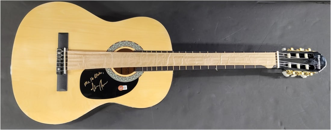Keola Beamer Autographed Acoustic Guitar with Beckett Authentication: Keola Beamer Autographed Acoustic Guitar with Beckett Authentication This is an authentic acoustic guitar signed by Keola Beamer, featuring the inscription "Me Ha Aloha." The autograph has been authen