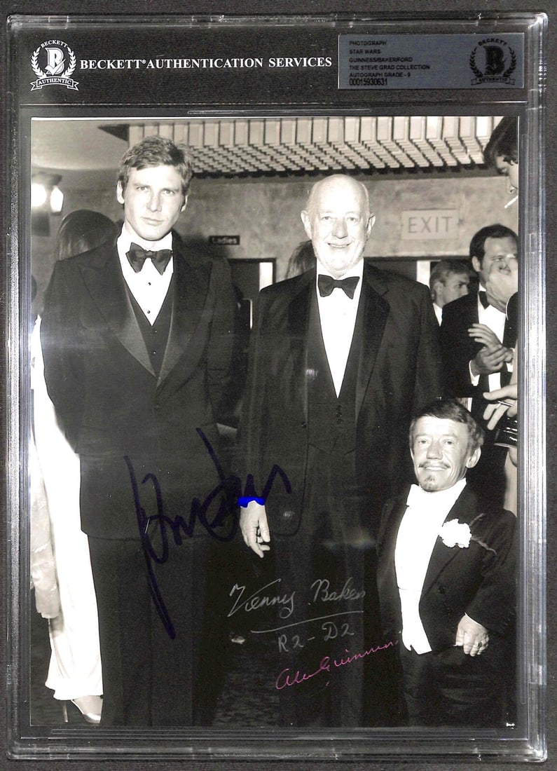 8x10 photo with Ford Guinness Baker signatures from 1977 Star Wars premiere Beckett: 8x10 photo with Ford Guinness Baker signatures from 1977 Star Wars premiere Beckett This is an original 8x10 black and white photograph signed by Harrison Ford, Alec Guinness, and Kenny Baker, three p