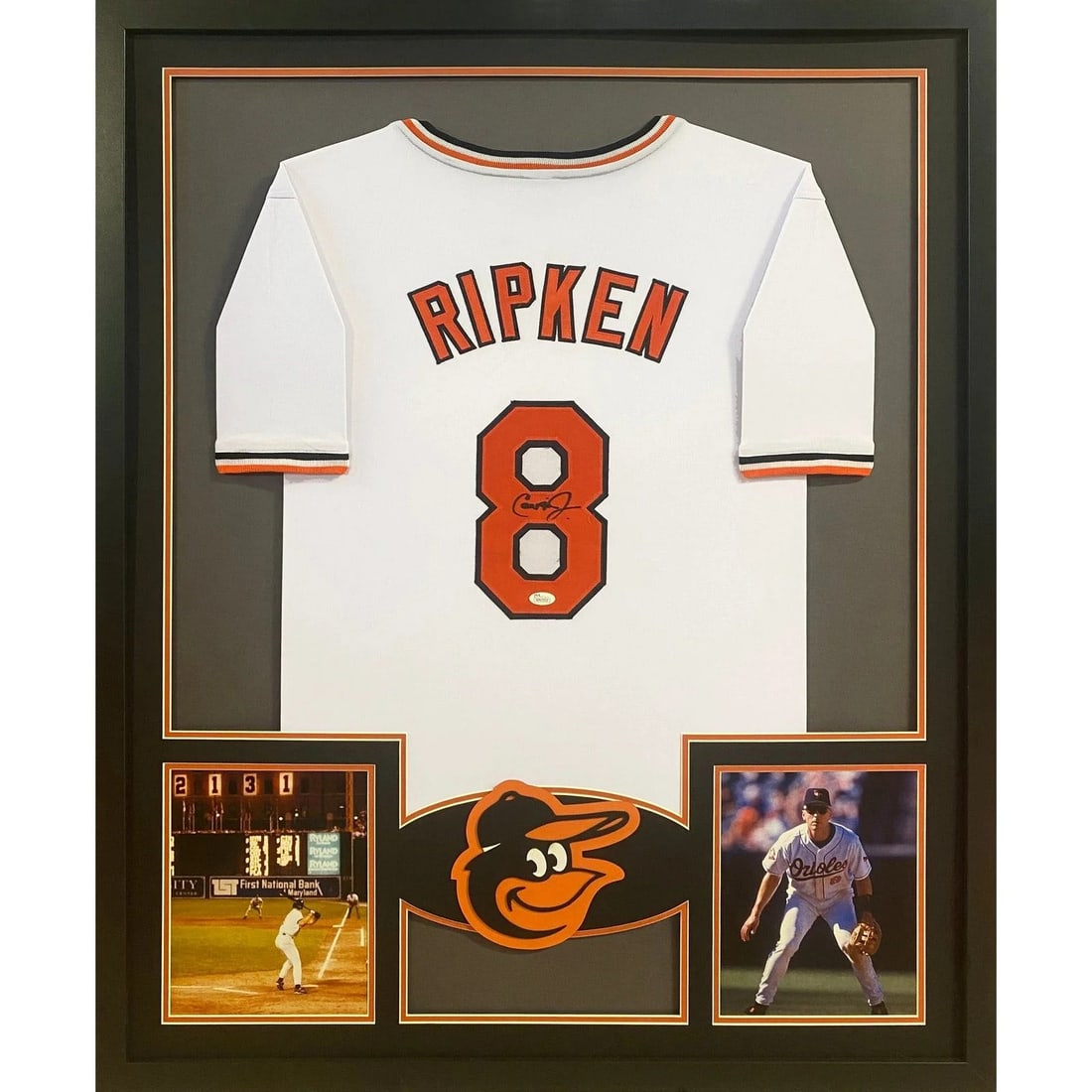 Framed Cal Ripken Jr. Signed Orioles Jersey with JSA Authentication: Framed Cal Ripken Jr. Signed Orioles Jersey with JSA Authentication This is a framed Baltimore Orioles jersey autographed by Cal Ripken Jr. The jersey has been authenticated by JSA and includes a tamp