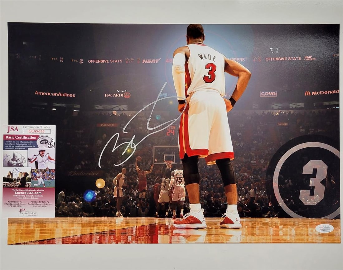 Dwyane Wade Autographed Miami Heat 12x18 Photo with JSA COA: Dwyane Wade Autographed Miami Heat 12x18 Photo with JSA COA This is an original Dwyane Wade signed 12x18 photo featuring the Miami Heat. The autograph has been authenticated by James Spence Authentica