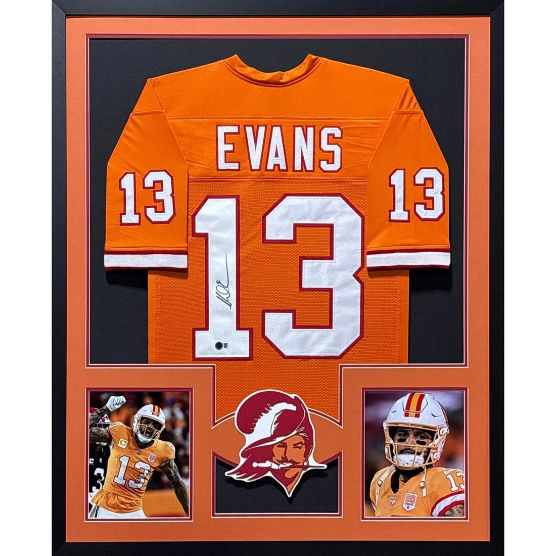 Framed Mike Evans Autographed Orange Buccaneers Jersey With Beckett Authentication: Framed Mike Evans Autographed Orange Buccaneers Jersey With Beckett Authentication This framed orange jersey is autographed by Mike Evans of the Tampa Bay Buccaneers and comes with authentication from