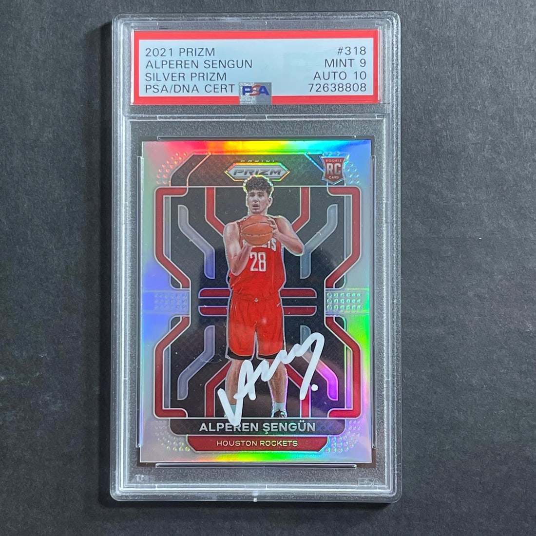 Alperen Sengun PSA 9 Rookie Auto Silver Prizm Card 318: Alperen Sengun PSA 9 Rookie Auto Silver Prizm Card 318 This is a 2021-22 Panini Silver Prizm #318 Alperen Sengun rookie card featuring an authentic autograph from Alperen Sengun of the Houston Rockets