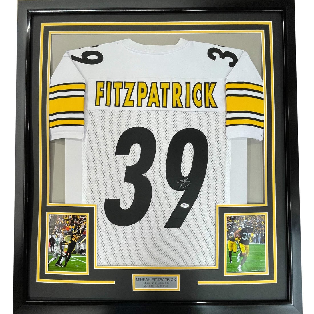 Framed Minkah Fitzpatrick Signed Steelers White Jersey PSA COA 33x42: Framed Minkah Fitzpatrick Signed Steelers White Jersey PSA COA 33x42 This framed Pittsburgh Steelers white jersey features an authentic autograph from NFL player Minkah Fitzpatrick. The jersey is prof
