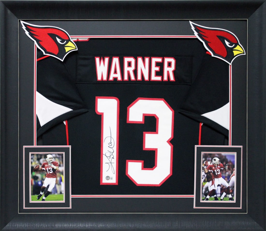 Framed Kurt Warner Signed Black Jersey With Beckett Authentication: Framed Kurt Warner Signed Black Jersey With Beckett Authentication This professionally framed black Pro Style Jersey has been personally signed by Kurt Warner of the Arizona Cardinals. The autograph i