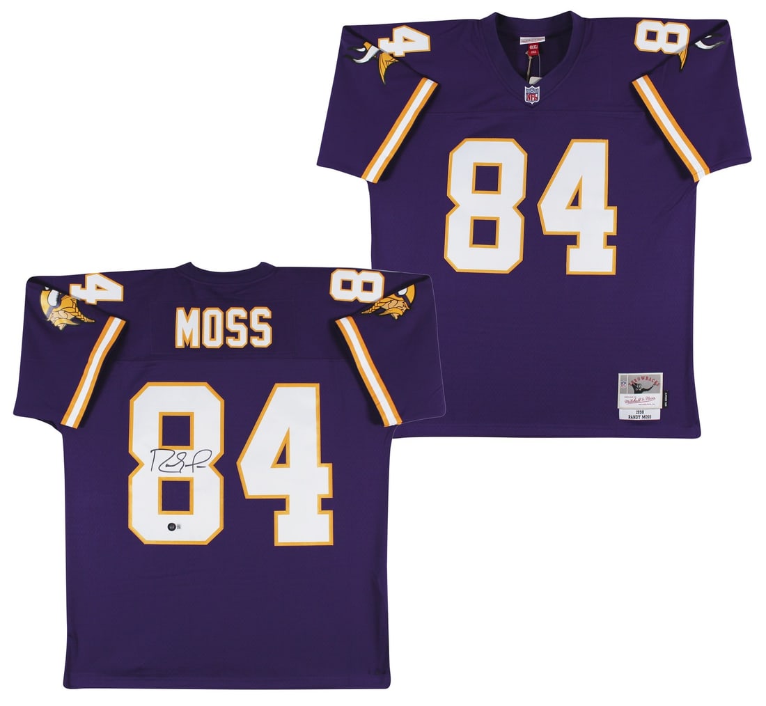 Randy Moss Autographed Mitchell & Ness Vikings Jersey Beckett BAS Witnessed: Randy Moss Autographed Mitchell & Ness Vikings Jersey Beckett BAS Witnessed This authentic purple Mitchell & Ness Minnesota Vikings jersey is personally signed by Randy Moss. The autograph is verified