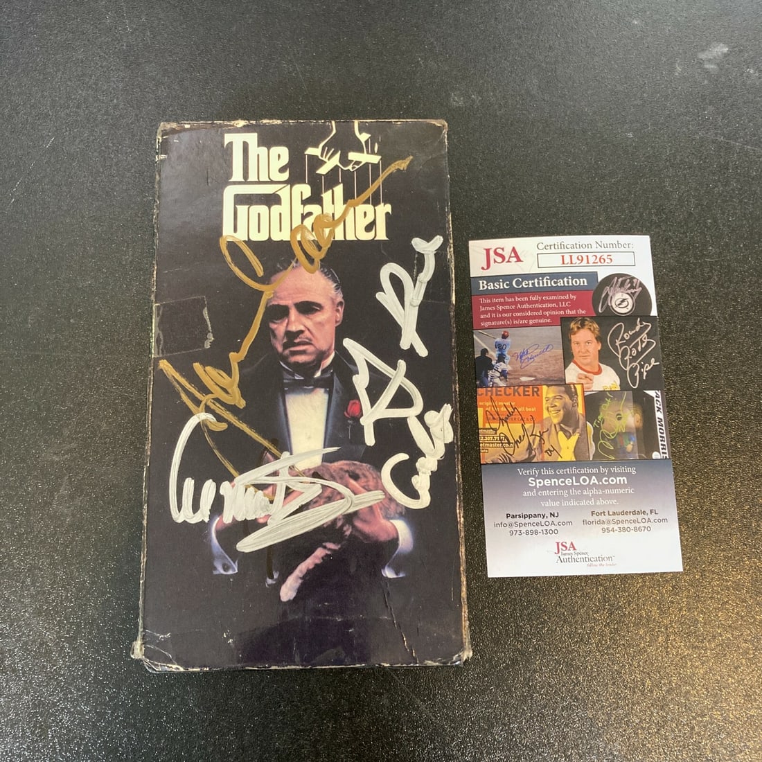 The Godfather Cast Signed VHS Movie with JSA Authentication: The Godfather Cast Signed VHS Movie with JSA Authentication This is an original VHS copy of "The Godfather" cast signed by notable figures, including James Caan, Gianni Russo, Al Martino, Abe Vigoda, 