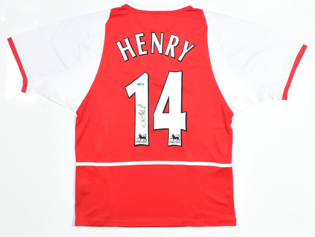 Arsenal Home Jersey Thierry Henry Autographed Beckett Holo #14: Arsenal Home Jersey Thierry Henry Autographed Beckett Holo #14 This Arsenal home soccer jersey features the signature of Thierry Henry and displays his iconic number 14. It is an original, pre-owned j