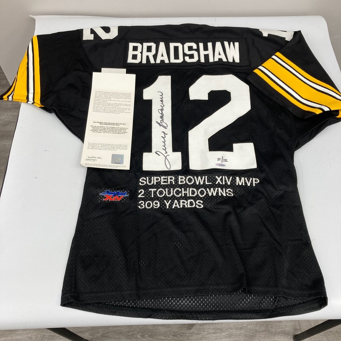 Terry Bradshaw Signed Limited Edition Steelers Jersey UDA COA 11/12: Terry Bradshaw Signed Limited Edition Steelers Jersey UDA COA 11/12 This limited edition commemorative jersey pays tribute to football legend Terry Bradshaw, featuring his iconic signature in black ma