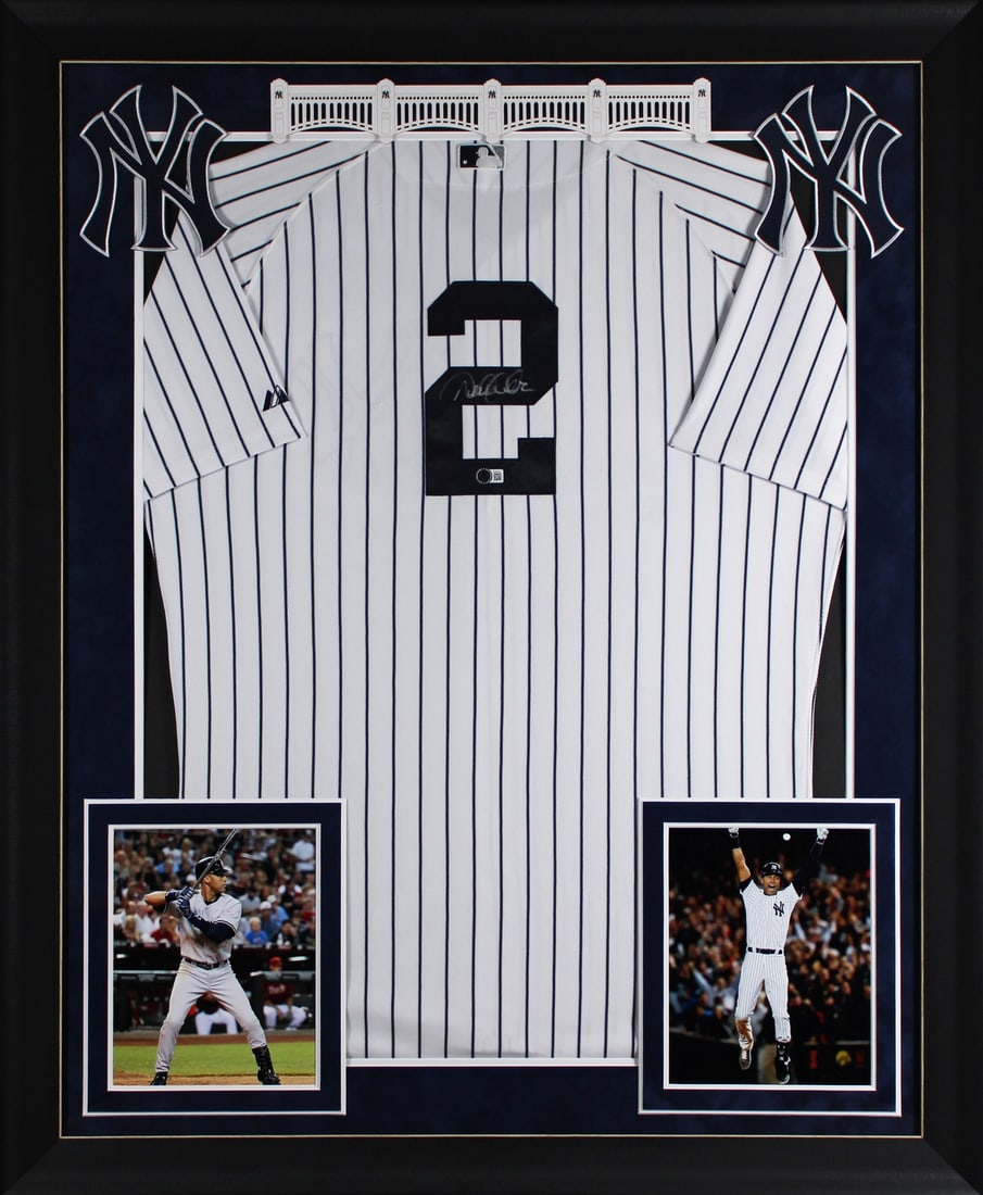 Framed Majestic Jersey Signed by Derek Jeter with Beckett COA: Framed Majestic Jersey Signed by Derek Jeter with Beckett COA This framed white pinstripe Majestic Cool Base jersey has been personally signed by Derek Jeter of the New York Yankees. The autograph has