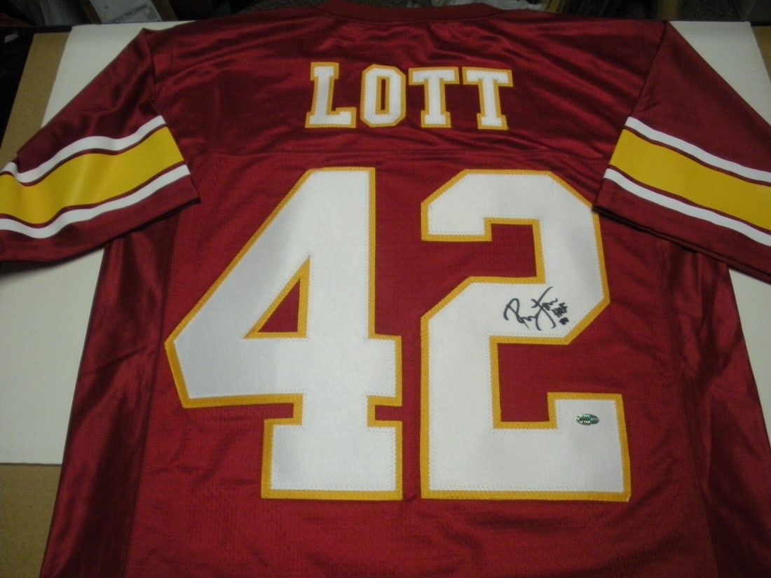 Ronnie Lott Autographed Official USC Trojans Jersey With COA Hall Of Fame 2000: Ronnie Lott Autographed Official USC Trojans Jersey With COA Hall Of Fame 2000 This is an officially licensed USC Trojans football jersey signed by Hall of Famer Ronnie Lott. The jersey is an original