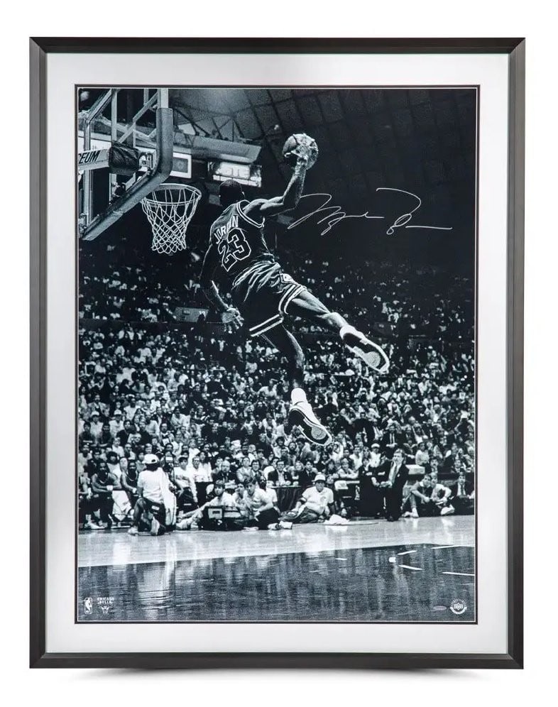Michael Jordan Autographed 30x40 Framed Photo Frozen in Time Upper Deck Authentic: Michael Jordan Autographed 30x40 Framed Photo Frozen in Time Upper Deck Authentic Celebrate Michael Jordan's iconic Slam Dunk Contest victory with this framed 30x40 photo titled "Frozen in Time." Capt