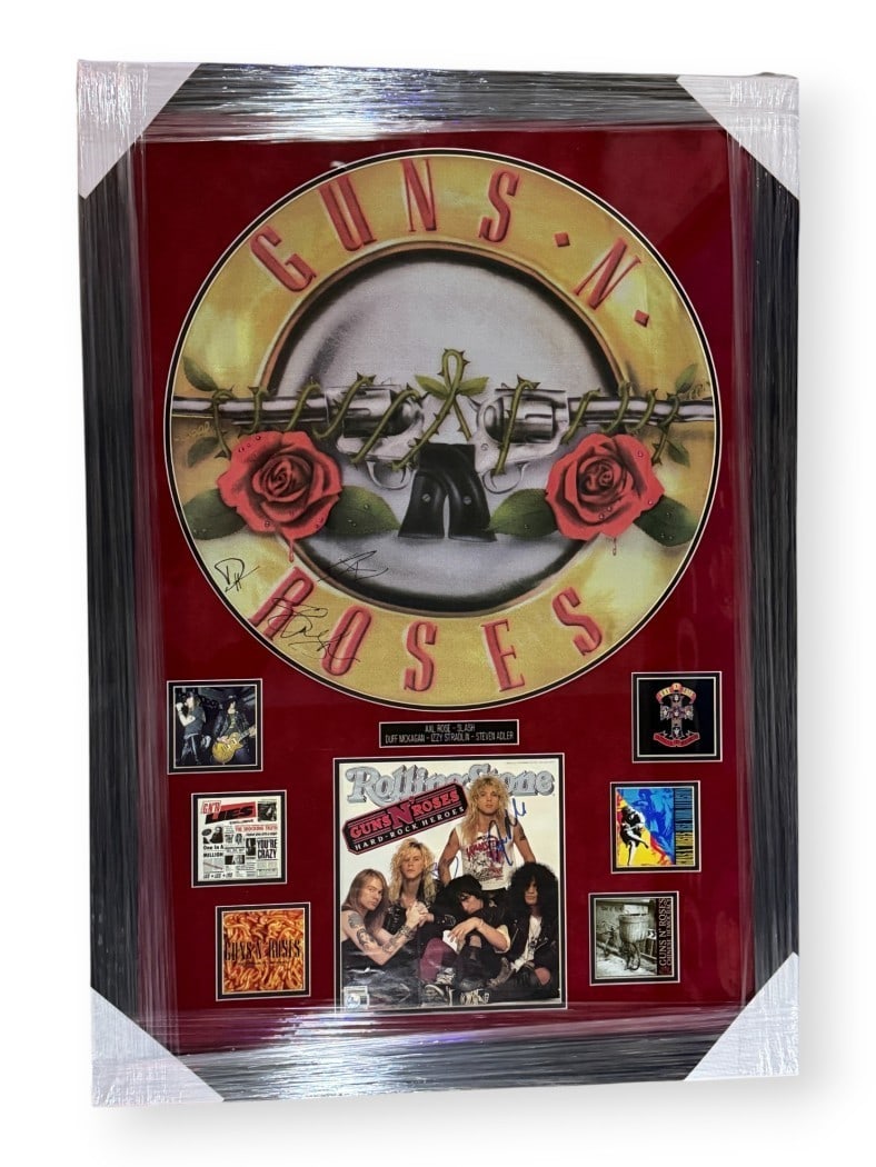 Framed Guns N' Roses Banner and Album Signed by Band Members JSA Authenticated: Framed Guns N' Roses Banner and Album Signed by Band Members JSA Authenticated This framed Guns N' Roses display features a hand-signed banner and album cover, autographed by band members Axl Rose, Sl