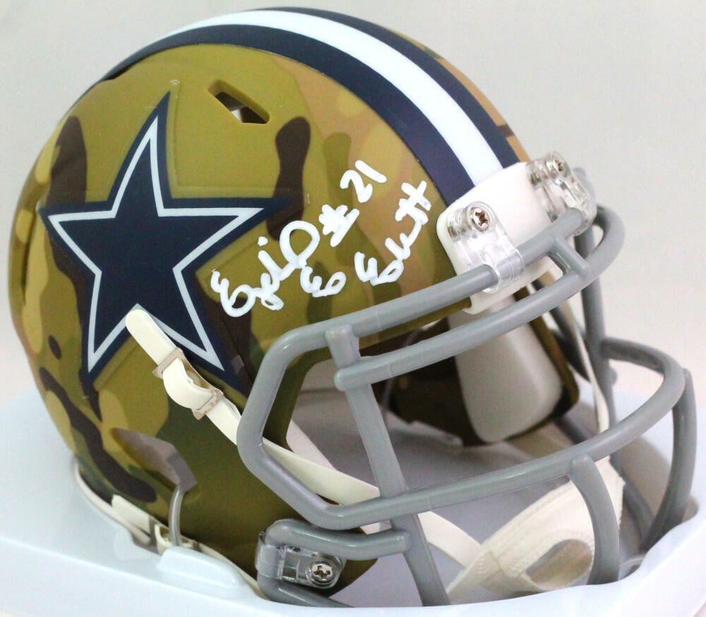 Dallas Cowboys camo mini helmet signed by Ezekiel Elliott Beckett: Dallas Cowboys camo mini helmet signed by Ezekiel Elliott Beckett This Dallas Cowboys camo mini helmet features the autograph of Ezekiel Elliott. The signature is authenticated by Beckett, ensuring it